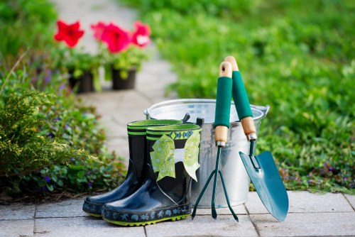 Gardeners preparing equipment with insurance badge