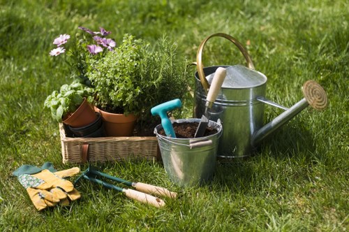 Gardener clearing a small front garden in Hayes town centre