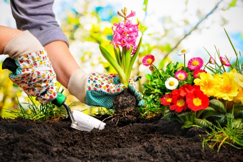 Charity volunteers collecting reusable pots and planters